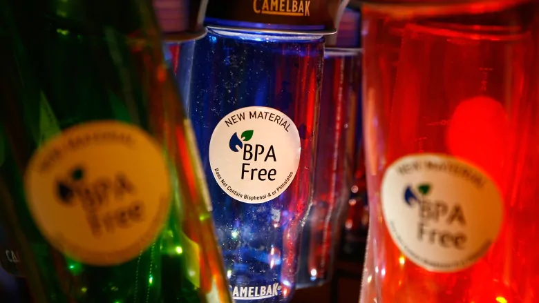 Three colorful plastic water bottles that are labeled BPA Free.