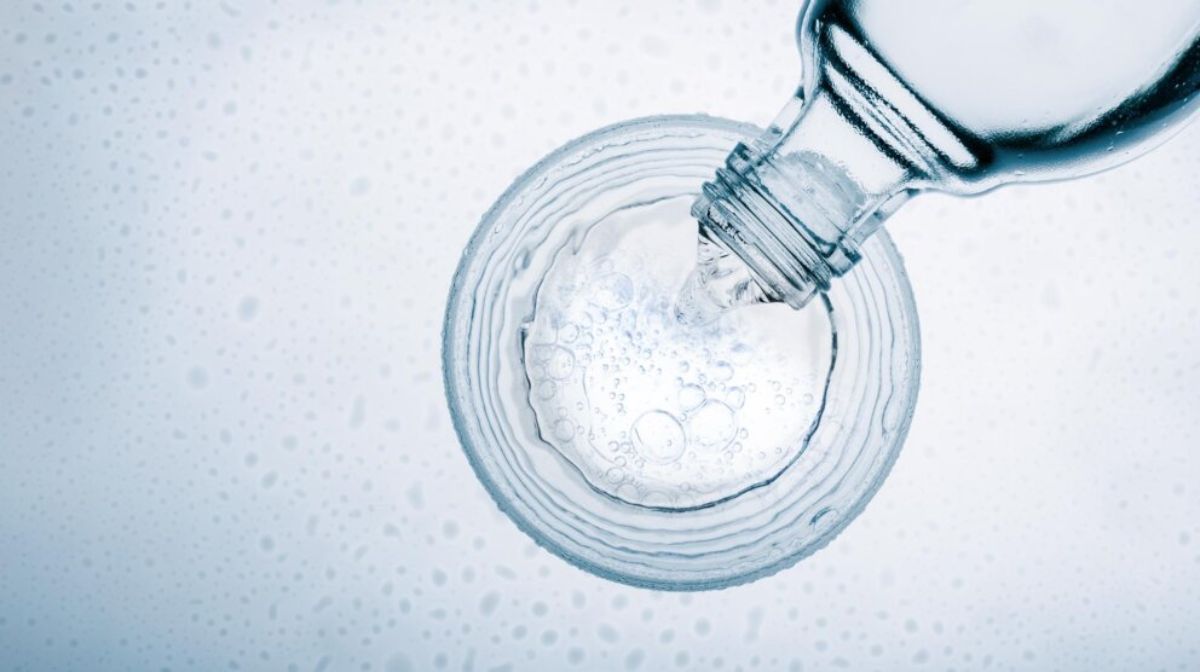 Does water expire in glass bottles A glass bottle pouring fresh water on a glass.