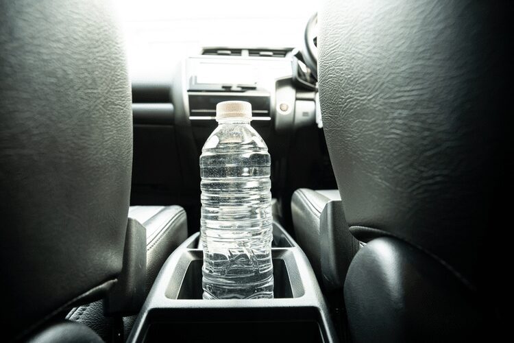 how to store water in car A bottled water inside the car's cup holder.